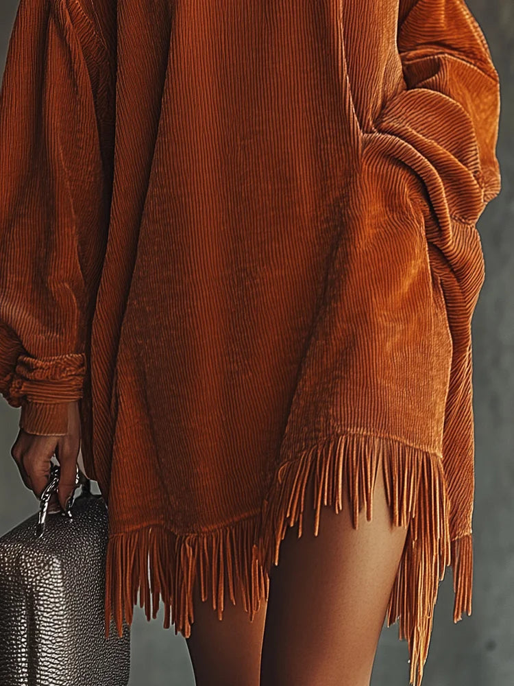 VESTIDO SUÉTER OVERSIZE DE PUNTO CON FLECOS