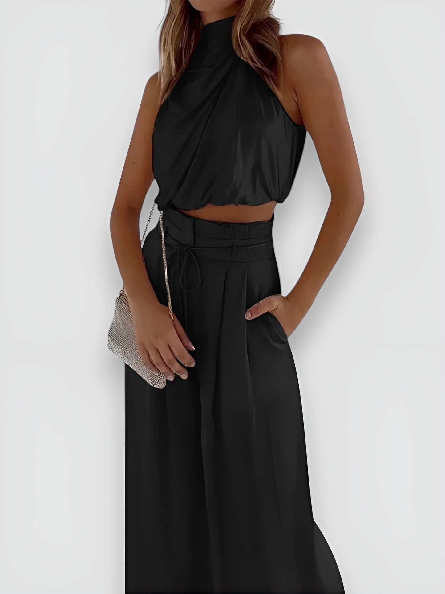 Conjunto elegante con top sin mangas y pantalón amplio